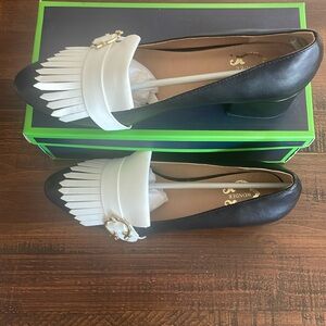 C. Wonder heeled loafer in black. New in box. Gold buckle and white fringe.